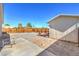 Backyard featuring gravel landscaping, wood fence, shed, picnic table, and fire pit area at 474 Adelle Ave, Overton, NV 89040