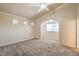 Spacious bedroom with neutral carpeting, ceiling fan, and ample natural light at 474 Adelle Ave, Overton, NV 89040