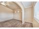 Spacious bedroom displaying large window and archway leading to adjoining room at 474 Adelle Ave, Overton, NV 89040