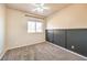 A neutral bedroom features a window with natural light and a ceiling fan at 474 Adelle Ave, Overton, NV 89040