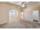 Primary bedroom showcasing carpeting, ceiling fan, and en-suite bathroom at 474 Adelle Ave, Overton, NV 89040