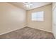 A neutral bedroom features a window with blinds, a ceiling fan and a carpeted floor at 474 Adelle Ave, Overton, NV 89040