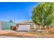 Charming single-story home featuring a two-car garage, neat landscaping and a quaint wooden fence at 474 Adelle Ave, Overton, NV 89040