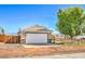 Charming single-story home featuring a two-car garage, neat landscaping and a quaint wooden fence at 474 Adelle Ave, Overton, NV 89040