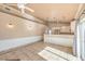Open living and kitchen area featuring modern lighting, stainless appliances, and seamless design at 474 Adelle Ave, Overton, NV 89040