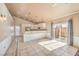 Open-plan living area with light-filled kitchen, access to the backyard, and neutral tones throughout at 474 Adelle Ave, Overton, NV 89040