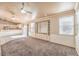 Spacious living room with built-in shelving, neutral decor, and seamless transition to the kitchen at 474 Adelle Ave, Overton, NV 89040