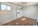 Carpeted room with natural light from a window, peg board, and a door at 474 Adelle Ave, Overton, NV 89040