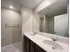 Bathroom featuring a double sink vanity with white countertop and dark wood cabinets at 483 Fairview Hills St, Las Vegas, NV 89138