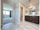 Bathroom featuring a double sink vanity with dark wood cabinetry and tile flooring at 483 Fairview Hills St, Las Vegas, NV 89138