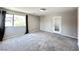 Carpeted bedroom with natural light from the window and a door to the hallway at 483 Fairview Hills St, Las Vegas, NV 89138