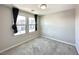 Bright bedroom with two large windows and neutral carpet, offering a comfortable and inviting space at 483 Fairview Hills St, Las Vegas, NV 89138
