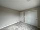 Cozy bedroom features neutral paint, carpet flooring, and a closet with sliding doors at 483 Fairview Hills St, Las Vegas, NV 89138