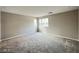 Spacious bedroom with neutral walls, plush carpeting, and bright windows for natural light at 483 Fairview Hills St, Las Vegas, NV 89138