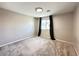 Cozy bedroom featuring soft carpet, ample natural light, and neutral paint at 483 Fairview Hills St, Las Vegas, NV 89138