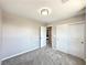 Bedroom featuring neutral walls and carpet, closet with sliding doors, and an open doorway at 483 Fairview Hills St, Las Vegas, NV 89138