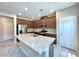 Bright kitchen features stainless steel appliances, granite counters, and brown cabinets at 483 Fairview Hills St, Las Vegas, NV 89138