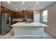 Well-equipped kitchen with a large island, granite countertops, and stainless steel appliances at 483 Fairview Hills St, Las Vegas, NV 89138