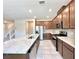 Bright kitchen features stainless steel appliances, granite counters, and brown cabinets at 483 Fairview Hills St, Las Vegas, NV 89138