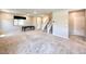 Expansive living room with plush carpet, stairs, and generous natural light throughout at 483 Fairview Hills St, Las Vegas, NV 89138