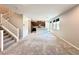 Inviting living room with stairs, carpet, and an open-concept layout connected to kitchen at 483 Fairview Hills St, Las Vegas, NV 89138