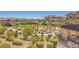 Expansive community park featuring mature trees, walking trails, green spaces, and seating areas at 49 Alamere Falls Dr, Las Vegas, NV 89138