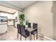 Cozy dining area adjacent to the kitchen, featuring a modern table and chairs at 49 Alamere Falls Dr, Las Vegas, NV 89138