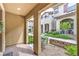Covered entryway with brick flooring offering a view of the landscaped community at 49 Alamere Falls Dr, Las Vegas, NV 89138