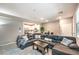 Comfortable living room featuring view to the kitchen and neutral decor at 49 Alamere Falls Dr, Las Vegas, NV 89138