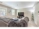 A spacious living room with plush seating, decorative accents, and ample natural light at 49 Alamere Falls Dr, Las Vegas, NV 89138