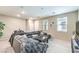 Comfortable living room with neutral paint, plush seating, and modern accents at 49 Alamere Falls Dr, Las Vegas, NV 89138