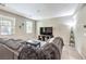 Comfortable living room with a plush sofa, large TV, and stylish decor at 49 Alamere Falls Dr, Las Vegas, NV 89138