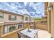 Comfortable outdoor patio features table and chairs with relaxing views at 49 Alamere Falls Dr, Las Vegas, NV 89138