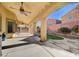 Large covered patio overlooking the backyard featuring a lush lawn at 4937 Teal Petals St, North Las Vegas, NV 89081