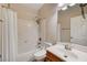 Bright bathroom with a shower-tub combo, a white vanity, and a large mirror at 4937 Teal Petals St, North Las Vegas, NV 89081