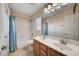 Bathroom featuring a double sink vanity, shower-tub combination, and neutral tones at 4937 Teal Petals St, North Las Vegas, NV 89081