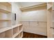 Spacious walk-in closet featuring built-in shelving, garment racks, and overhead storage at 4937 Teal Petals St, North Las Vegas, NV 89081