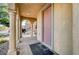Covered front porch featuring stone pillars, an arched entryway, and a secure front door at 4937 Teal Petals St, North Las Vegas, NV 89081