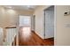 Hallway with hardwood floors and white paneled doors is bright and roomy at 4937 Teal Petals St, North Las Vegas, NV 89081