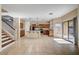 Bright kitchen with stainless appliances, center island, tile floor and access to backyard at 4937 Teal Petals St, North Las Vegas, NV 89081