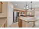 Updated kitchen with modern appliances, granite countertops, island and plenty of cabinet space at 4937 Teal Petals St, North Las Vegas, NV 89081
