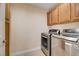 Laundry area featuring modern washer and dryer at 4937 Teal Petals St, North Las Vegas, NV 89081