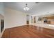 Spacious living room boasts hardwood floors, a fireplace, and an open layout to the kitchen at 4937 Teal Petals St, North Las Vegas, NV 89081