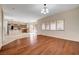 Open-concept layout showcases the living room with hardwood floors and the adjacent kitchen at 4937 Teal Petals St, North Las Vegas, NV 89081