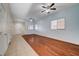 Open living area with hardwood floors, tile entryway, a ceiling fan, and ample natural light at 4937 Teal Petals St, North Las Vegas, NV 89081