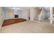 Open living area with fireplace, hardwood flooring, and staircase access to upper level, offering a functional design at 4937 Teal Petals St, North Las Vegas, NV 89081