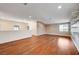 Bright and airy living room with hardwood floors and bright sunlight through the windows at 4937 Teal Petals St, North Las Vegas, NV 89081