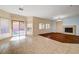 Bright, open living area features tile flooring and fireplace, with a large sliding glass door to the outdoor space at 4937 Teal Petals St, North Las Vegas, NV 89081