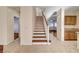 Inviting staircase features wood treads, white risers, and an open layout to the living areas at 4937 Teal Petals St, North Las Vegas, NV 89081