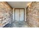 Inviting entryway with stone accents and double doors, creating a grand entrance at 4998 Schumann Dr, Las Vegas, NV 89146